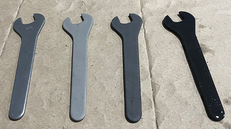 Image of gray and black wrenches lined up