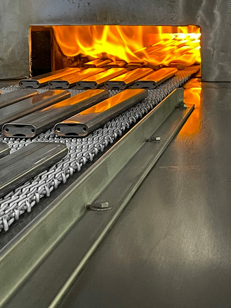 Image of metal parts being treated