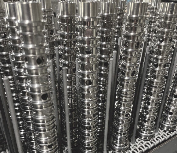 Rows of metal parts showing stress relieving process